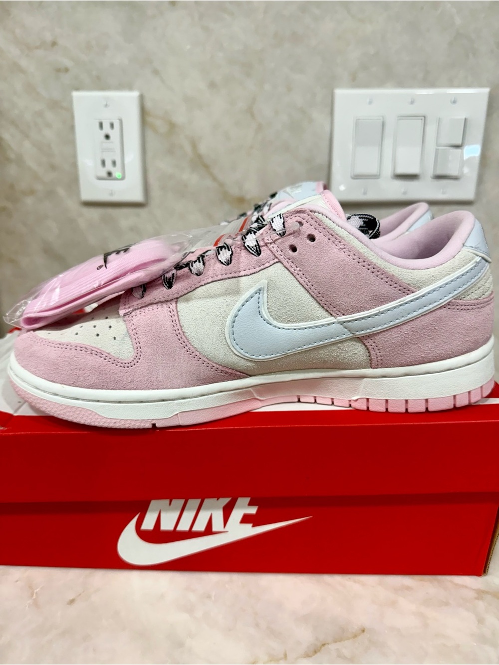 Nike Pink and White Suede Low Top Sneakers